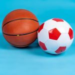 basketball soccer balls blue surface